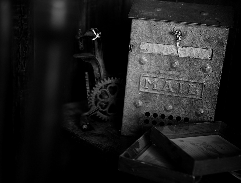 antique mailbox on shelf